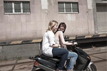 simsearch:700-06190615,k - Young Women on Scooter Stock Photo - Premium Royalty-Free, Code: 600-03814798