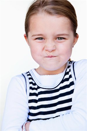 defiant behavior - Girl Making Face Stock Photo - Premium Royalty-Free, Code: 600-03821108