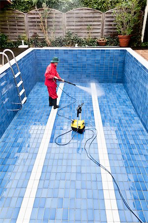 empty shoes - Man Cleaning Swimming Pool, Germany Stock Photo - Premium Royalty-Free, Code: 600-03836409