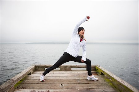 simsearch:700-03407855,k - Woman Stretching on Dock before Jogging, Puget Sound, Seattle, Washington, USA Stock Photo - Premium Royalty-Free, Code: 600-03849027