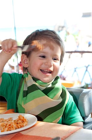 simsearch:600-05653250,k - Boy Eating Pasta in Restaurant, Playa del Carmen, Mexico Stock Photo - Premium Royalty-Free, Code: 600-03849166