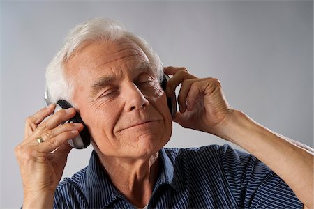 Man Listening to Music Stock Photo - Premium Royalty-Free, Code: 600-03865074