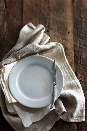 Antique Knife, Plate and Cloth Napkins Stock Photo - Premium Royalty-Free, Code: 600-03891295