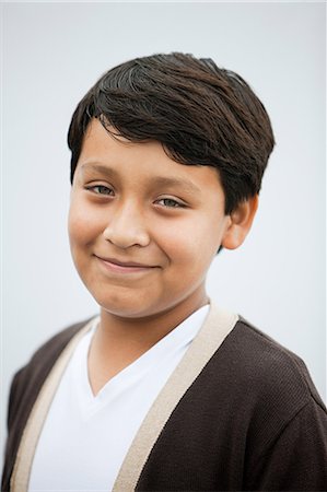 Boy smiling to camera, portrait Stock Photo - Premium Royalty-Free, Code: 614-05399292