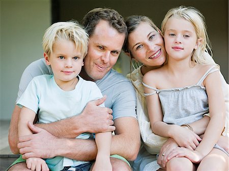 father hugging his son and daughter - Family portrait Stock Photo - Premium Royalty-Free, Code: 614-05399323