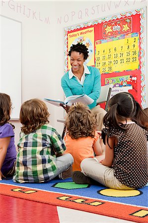 preschool - Teacher reading to children Stock Photo - Premium Royalty-Free, Code: 614-05523136