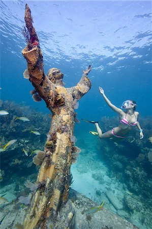 female snorkeler - Christ of the Abyss statue Stock Photo - Premium Royalty-Free, Code: 614-05556746