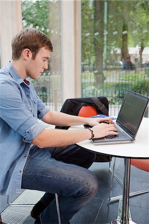 student (male) - University student working on laptop Stock Photo - Premium Royalty-Free, Code: 614-05557327