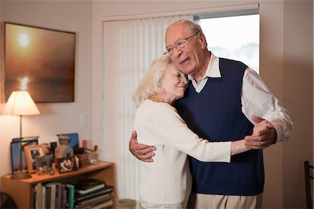 senior woman glasses - Senior couple dancing in living room Stock Photo - Premium Royalty-Free, Code: 614-05650725
