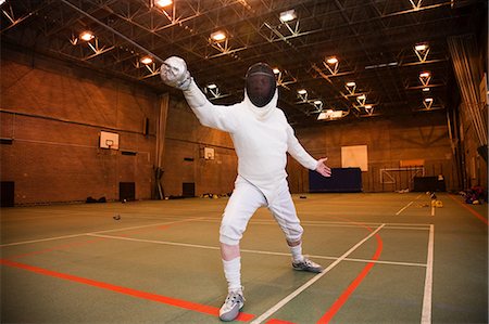 senior men at the gym - Senior man in fencing suit holding foil Stock Photo - Premium Royalty-Free, Code: 614-05792183