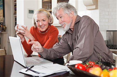 Senior couple using laptop Stock Photo - Premium Royalty-Free, Code: 614-05792318