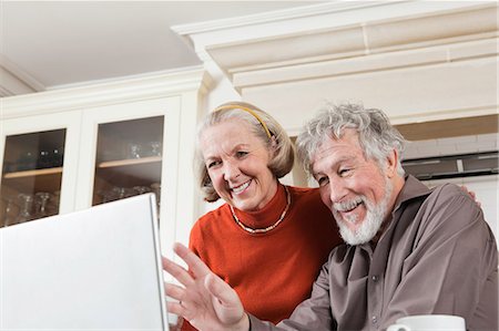 Senior couple using webcam on laptop Stock Photo - Premium Royalty-Free, Code: 614-05792319