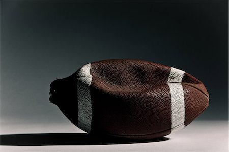 football (american ball) - Deflated american football Foto de stock - Sin royalties Premium, Código: 614-05792437