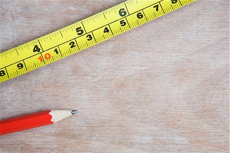 Measuring tape and pencil Stock Photo - Premium Royalty-Free, Code: 614-05819012