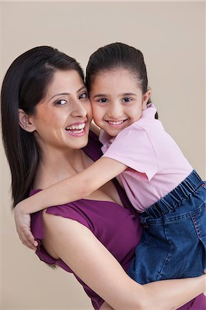 ethnic mother and daughter - Portrait of mother and daughter Stock Photo - Premium Royalty-Free, Code: 614-05955361