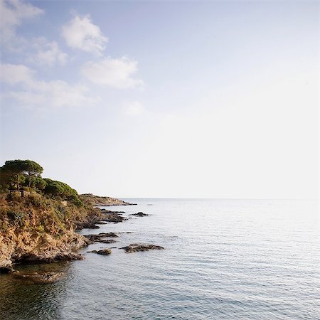 simsearch:614-06814364,k - Coast and rocks tumbling into the sea, Costa Brava, Spain Stock Photo - Premium Royalty-Free, Code: 614-05955584