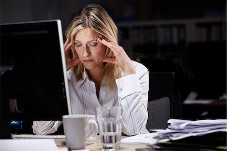 simsearch:6108-06167824,k - Stressed businesswoman working late Stock Photo - Premium Royalty-Free, Code: 614-05955720