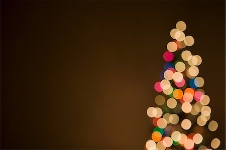 Christmas lights on tree, out of focus Stock Photo - Premium Royalty-Free, Code: 614-05955786