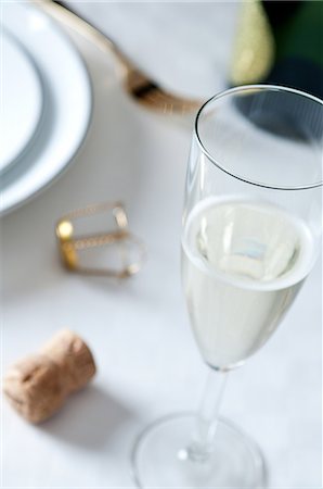 Glass of champagne on table Stock Photo - Premium Royalty-Free, Code: 614-06002086