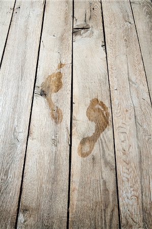 steps high angle - Wet footprints on floorboards Stock Photo - Premium Royalty-Free, Code: 614-06044124
