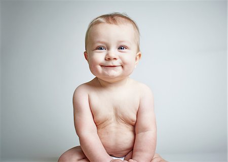 picture of a baby boy smiling - Baby boy smiling Stock Photo - Premium Royalty-Free, Code: 614-06043980