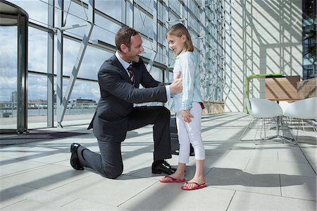 Father arriving in airport with daughter Stock Photo - Premium Royalty-Free, Code: 614-06116002