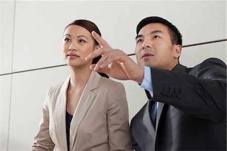 simsearch:614-06896117,k - Business colleagues, man pointing Stock Photo - Premium Royalty-Free, Code: 614-06116488