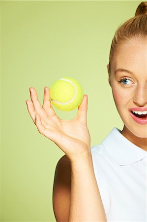 Young woman holding tennis ball Stock Photo - Premium Royalty-Free, Code: 614-06169490