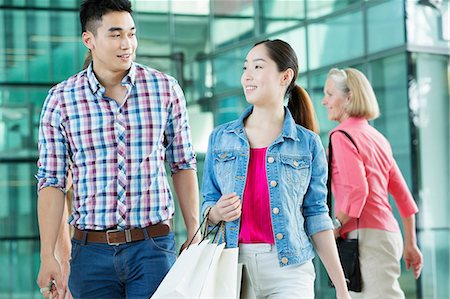 people on mall - Young couple in shopping mall Stock Photo - Premium Royalty-Free, Code: 614-06169548