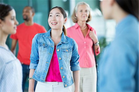 Young woman in crowd Stock Photo - Premium Royalty-Free, Code: 614-06169581