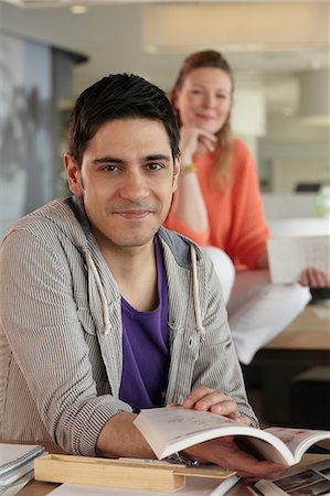 Man holding book, portrait Stock Photo - Premium Royalty-Free, Code: 614-06311681