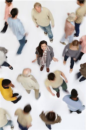 Woman standing in crowd of people, high angle view Stock Photo - Premium Royalty-Free, Code: 614-06311771