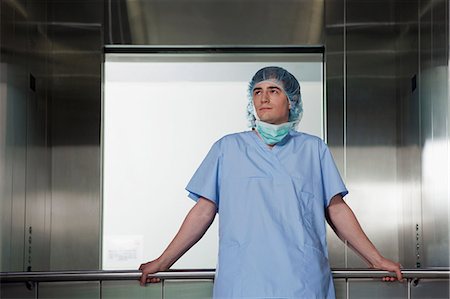 Portrait of surgeon in hospital elevator Stock Photo - Premium Royalty-Free, Code: 614-06336260