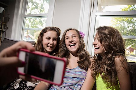 simsearch:614-06402677,k - Group of girls being photographed with camera phone Stock Photo - Premium Royalty-Free, Code: 614-06402692