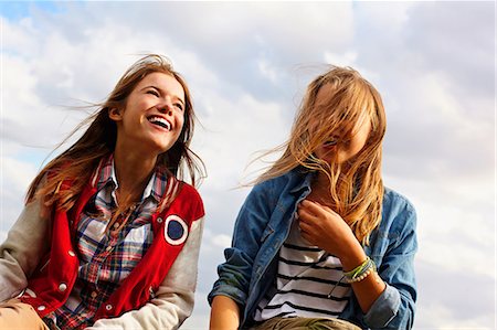 friends laughing - Happy teenage girls Stock Photo - Premium Royalty-Free, Code: 614-06403024