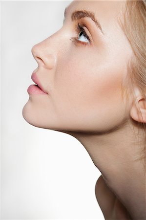 face sideview - Woman looking up Stock Photo - Premium Royalty-Free, Code: 614-06442319