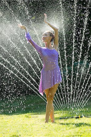 Ballerina in water sprinkler Stock Photo - Premium Royalty-Free, Code: 614-06442787