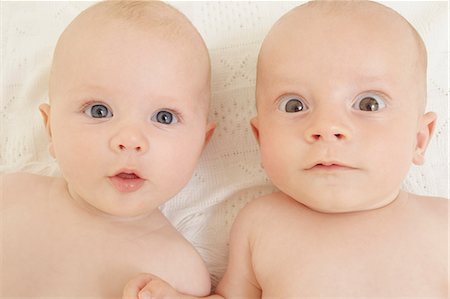 surprise - Baby boy and baby girl staring at camera Stock Photo - Premium Royalty-Free, Code: 614-06442838