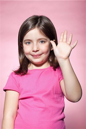 Girl waving Stock Photo - Premium Royalty-Free, Code: 614-06442861