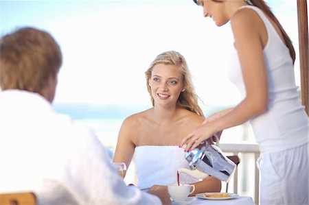 eating outside restaurant - Waitress serving woman coffee at table Stock Photo - Premium Royalty-Free, Code: 614-06537014