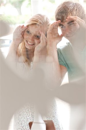 peeking - Couple window shopping together Stock Photo - Premium Royalty-Free, Code: 614-06537075