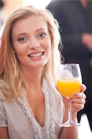 simsearch:614-06536948,k - Woman having orange juice in cafe Stock Photo - Premium Royalty-Free, Code: 614-06537167