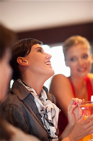 Women having drinks together at bar Stock Photo - Premium Royalty-Free, Code: 614-06537207