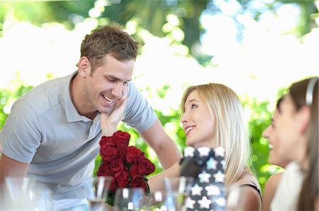 simsearch:614-06537078,k - Man giving girlfriend bouquet of flowers Stock Photo - Premium Royalty-Free, Code: 614-06537624