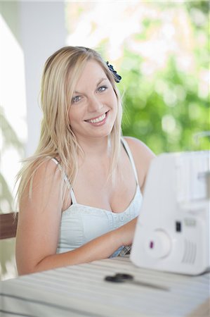 simsearch:614-06536948,k - Woman working on sewing machine Stock Photo - Premium Royalty-Free, Code: 614-06537637
