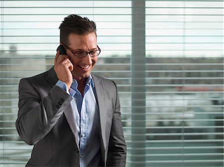 Businessman talking on cell phone Stock Photo - Premium Royalty-Free, Code: 614-06624210