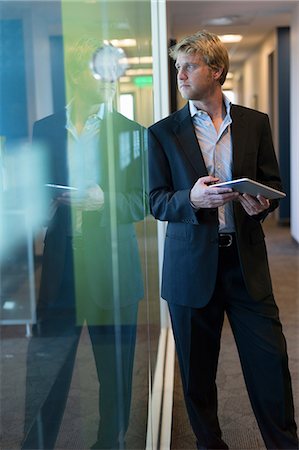 simsearch:614-06043814,k - Businessman with tablet in office Stock Photo - Premium Royalty-Free, Code: 614-06624369