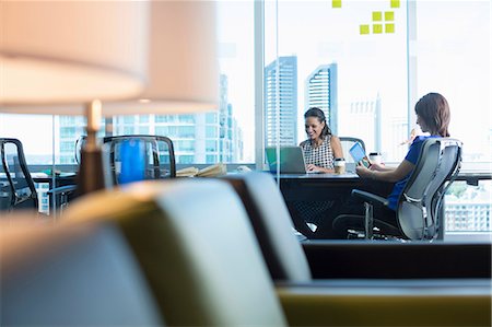 portable information device - Businesswomen working at desk Stock Photo - Premium Royalty-Free, Code: 614-06624391