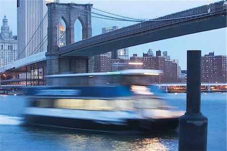 river bridge in america - Blurred view of boat on urban river Stock Photo - Premium Royalty-Free, Code: 614-06624701