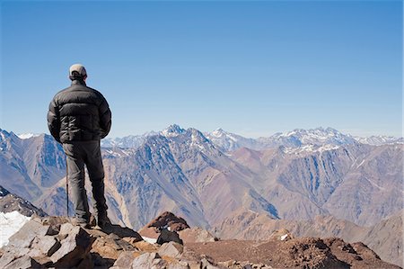expedition - Hiker overlooking snowy mountains Stock Photo - Premium Royalty-Free, Code: 614-06625126